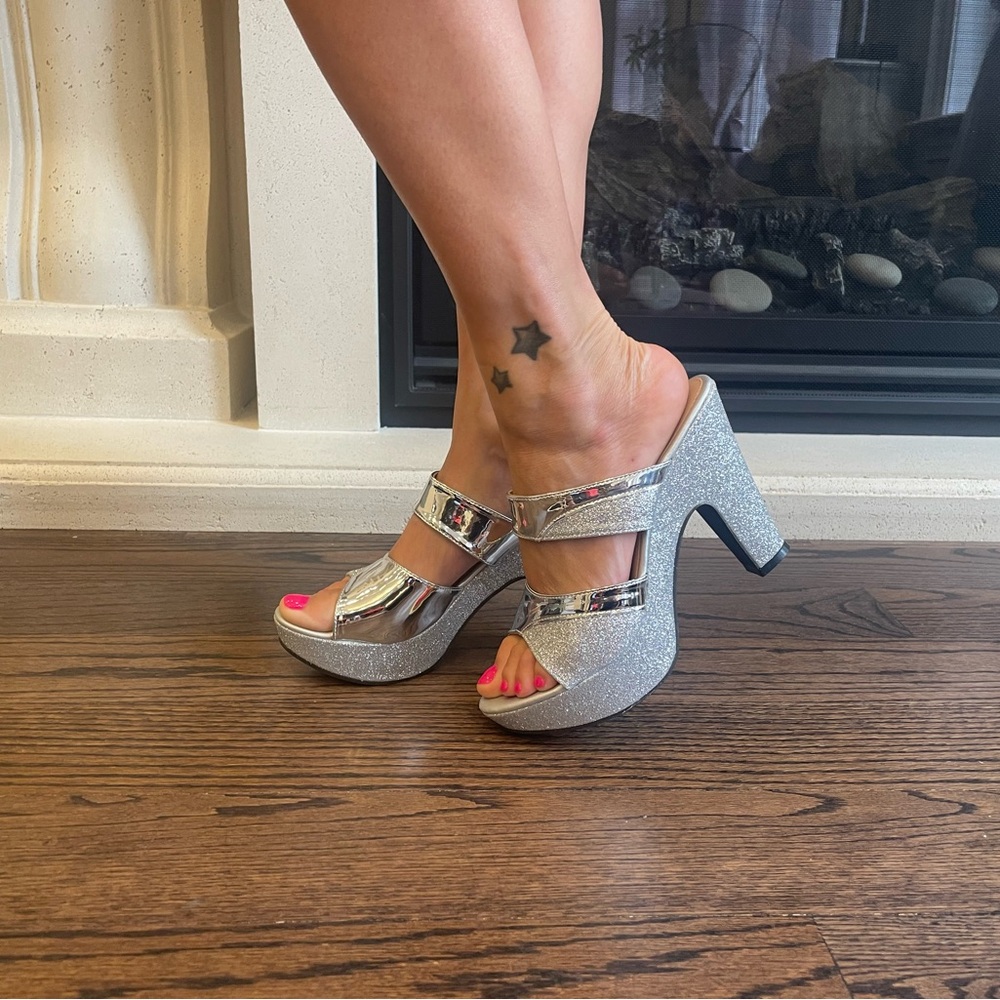 Silver black heel platform sandals. 4inch heel platform . Never worn.